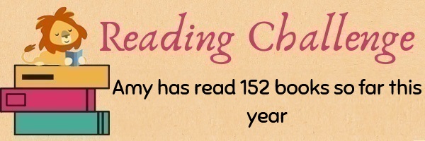 Text: Reading Challenge Amy has read 152 books so far this year. Image: A cartoon lion reading a book on a stack of larger books.